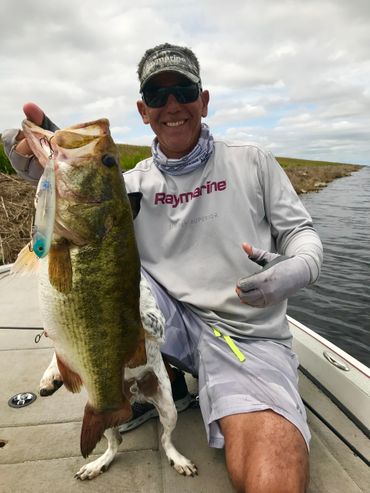 image of tour guide holding a large caught fish